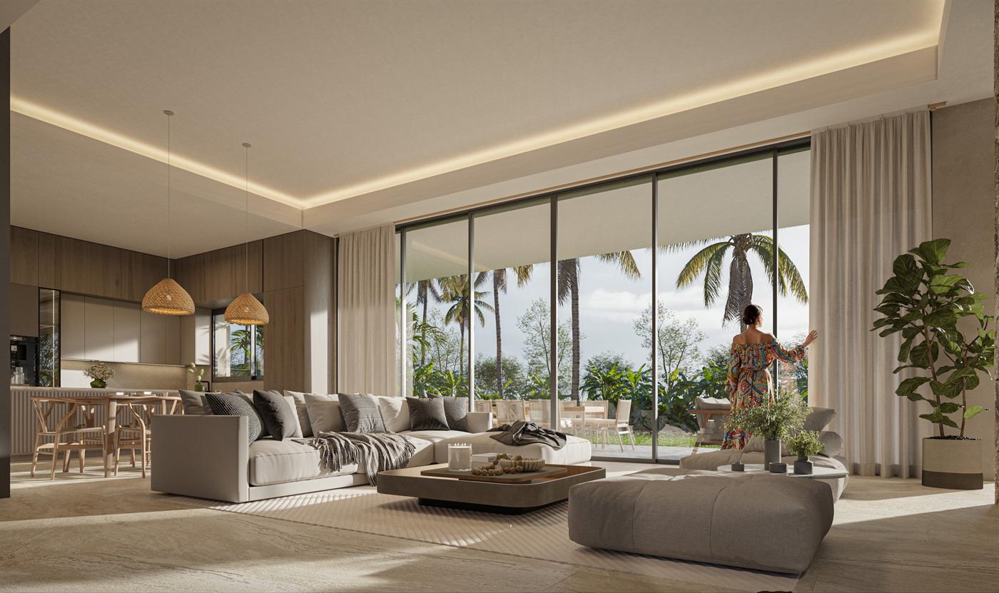 Sala interior amplia con ventanales hacia el jardín